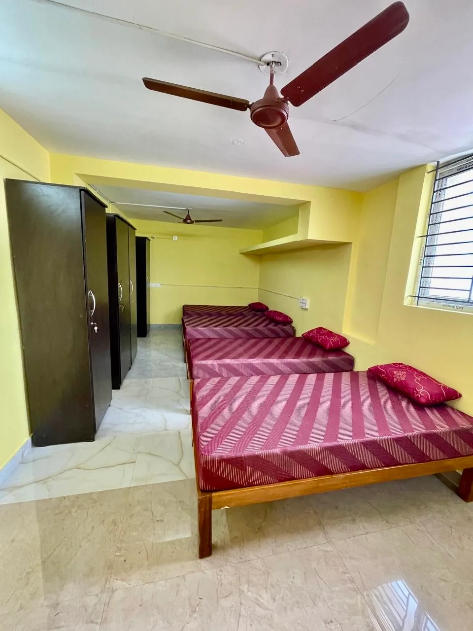 Spacious room at Q Residency with wardrobes